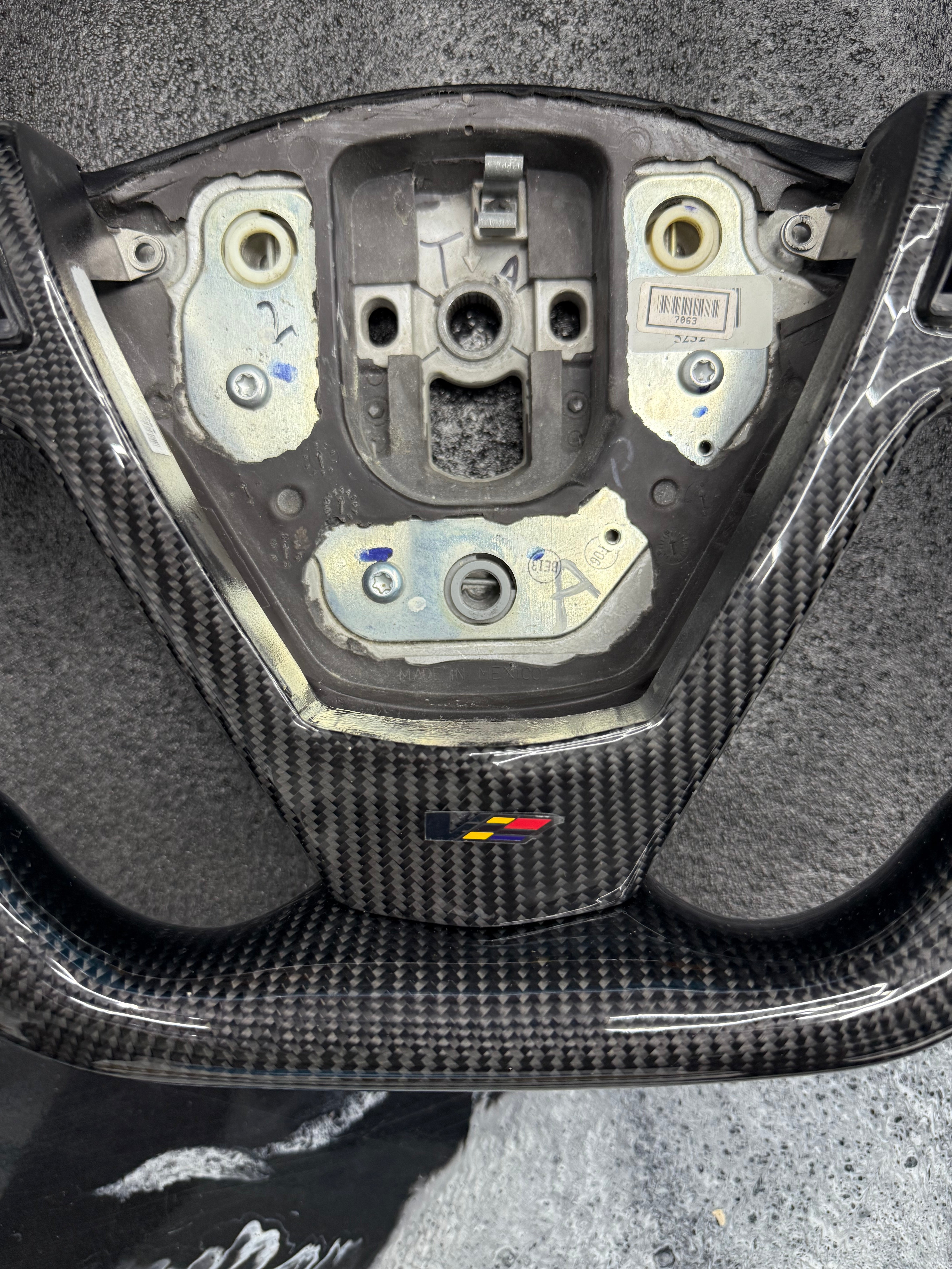 2003 - 2008 CTS, CTS-V V1 Custom Carbon Fiber Steering Wheel with Perforated Leather Hand Grips / Leather Rear Cover